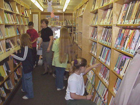 Cathie Bixler helps some students